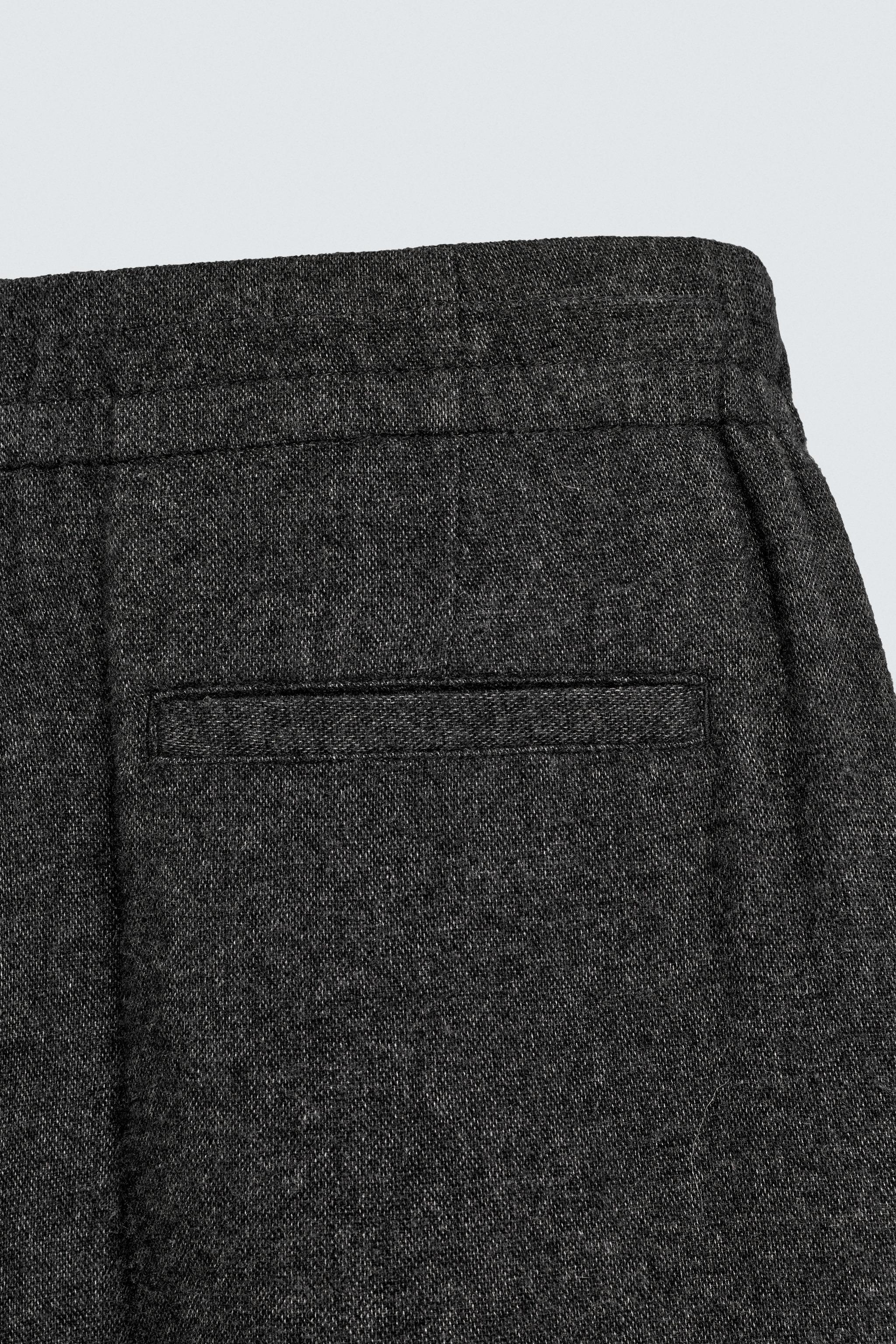 PLEATED WOOL PANTS